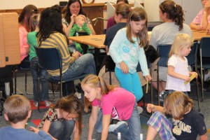 Homeschooling adults and their children are meeting at the Syracuse Library to network on the fourth Thursday of the month. Gisela Vore, children’s librarian, entertains the kids with interactive activities while the adults share resources and discuss ways that the library can meet their learning needs. Homeschooling patrons are welcome to join the group. The next meeting is 2 p.m. Oct. 24.  (Photo provided)