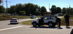 Police search a vehicle along U.S. 30 in Warsaw Thursday after the driver fled officers on foot. (Photo provided)