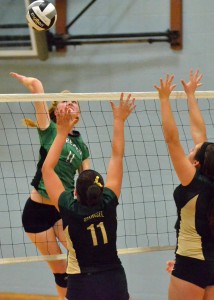 Bremen's Cassie Sears hammers home the game winning kill in the third and final set against Wawasee on Saturday. 