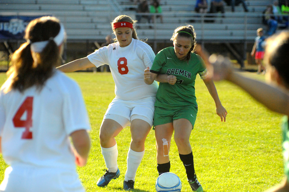 Whitko's Emily Jones (8) squares up with Bremen's Claire Schmidt Tuesday night in varsity soccer action in South Whitley. (Photos by Mike Deak)