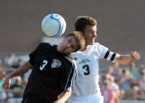 Huntington North's Tyler Henline battles for a header against Wawasee's Jan Jensen.