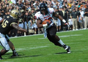 Northern Illinois running back Cameron Stingily finds a hole in the Purdue defense.