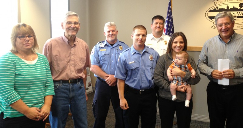 Brandon Allen, center, was sworn in as the newest member of the Warsaw-Wayne Fire Territory. 