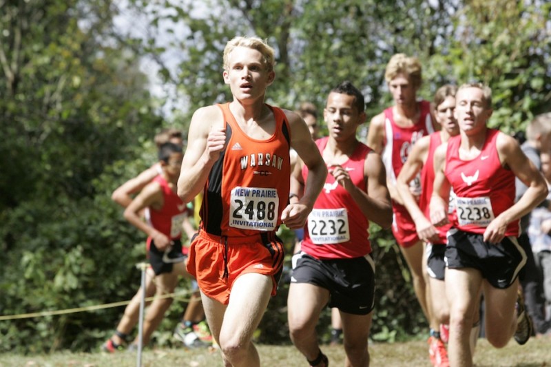 Warsaw sophomore standout Owen Glogovsky leads a pack of runners Saturday at the New Prairie Invitational. Glogovsky was 19th overall to lead the Tigers to a sixth place finish.