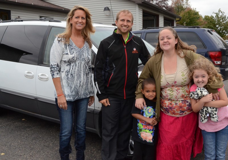 From left are Stacey Page; Chad Laughlin of Laughlin Family Auto, Warsaw; and April McCool with her children Zamien and Jessica. (Photo by Alyssa Richardsom)