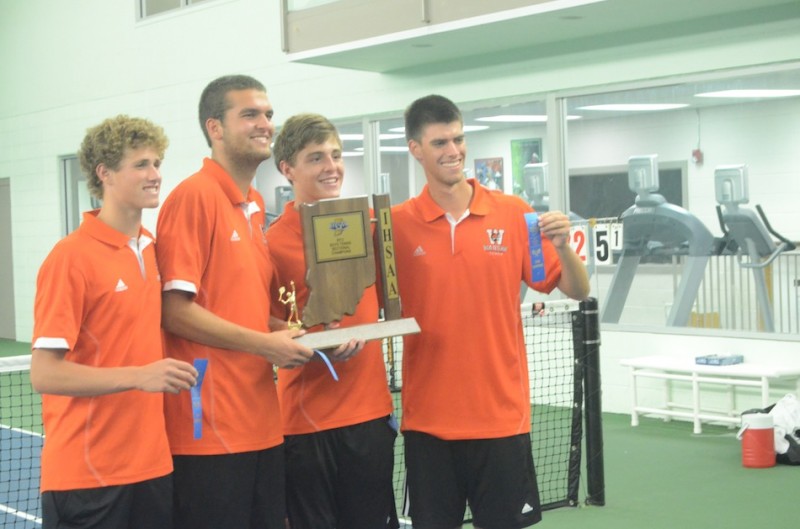 Warsaw seniors Will Petro, Nikos Schlitt, Evan Miller and Kyle Wettschurack display the sectional championship trophy. The quartet leads the Tigers into regional play Tuesday at Culver Academies (Photo by Scott Davidson)