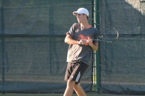 Kyle Wettschurack watches his return Wednesday. The Warsaw senior won at No. 2 singles for the regional champion Tigers.