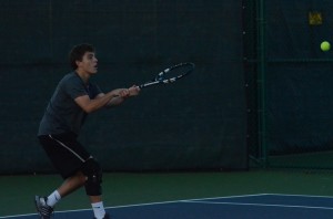 Evan Miller returns a shot during his win at No. 3 singles for Warsaw Wednesday (Photos by Scott Davidson)