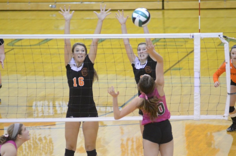 Jordyn Lindeman (left) and Laura Craig of Warsaw go up to block the shot of Concord's Francesca Rodino Thursday night. The Tigers beat the hosts 3-0 in NLC action (Photos by Scott Davidson)