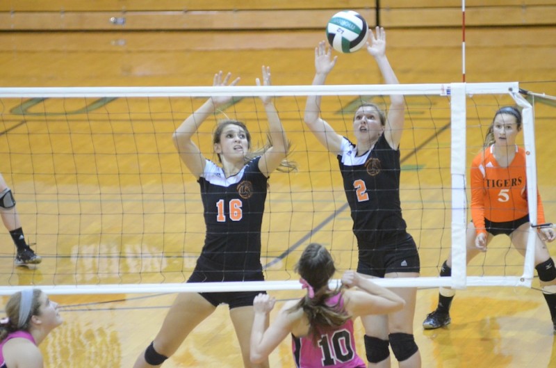 Warsaw senior Laura Craig blocks the ball versus Concord in a recent match. Craig helped the Tigers place second Saturday in the Clinton Prairie Invitational (File photo by Scott Davidson)
