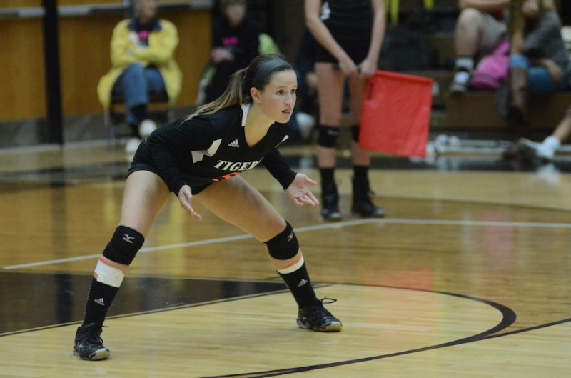 Warsaw libero Peyton Adamiec readies for a play in a recent match. Adamiec helped the Tigers rally to edge Fort Wayne Carroll 3-2 Wednesday night (File photo by Scott Davidson)