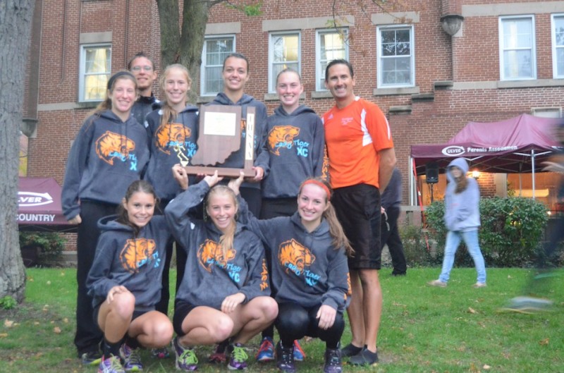 The Warsaw girls cross country team captured the sectional championship Tuesday night at Culver Academies. It was the third straight sectional title for coach Scott Erba's program (Photos by Scott Davidson)