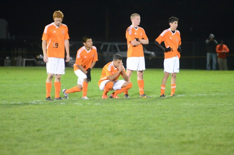 Warsaw players (from left) Stephen Kolbe, Miguel Rivera, Manuel Rodriguez, Sam Allbritten and Tito Cuellar prepare for a penalty kick shootout. All five converted their pk's to lift the No. 9 Tigers to a regional semifinal win Thursday night.