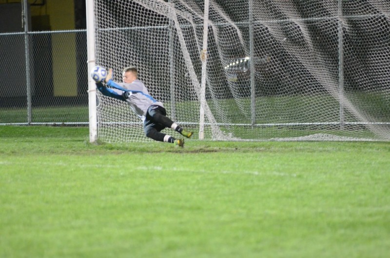 Warsaw goalie Peyton Long makes the game winning save in a penalty kick shootout Thursday night in a regional semifinal win over St. Joseph (Photos by Scott Davidson)
