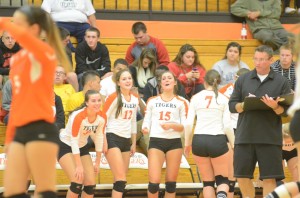 The Warsaw bench celebrates during sectional play Saturday.