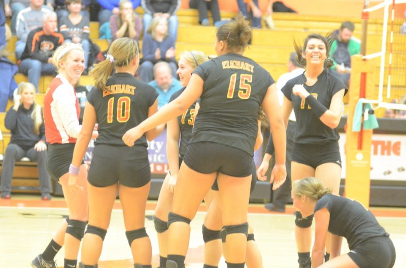 Elkhart Memorial celebrates after rallying to beat host Warsaw 3-2 in volleyball sectional semifinal action.