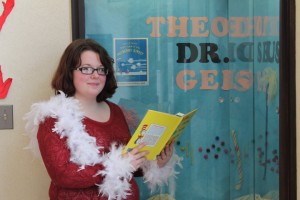 Emily Chupp is practicing some lines in preparation for the Seussical Event on Oct. 31. Emily had so much fun when she visited the Syracuse Library last Halloween that she volunteered to be part of this year’s event. The library has a very nice bag of treats for everyone that stops by, even though the character giving it is a little grumpy.  (Photo provided)