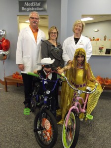 Pictured are costume contest winners Landon Smith and Taylor Schreck. In back are Mike Taylor, MedStat physician assistant; Tammy Cotton, Syracuse Wawasee Chamber of Commerce executive director; Laura Wheeler, MedStat Nurse Practitioner.