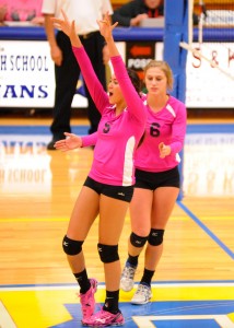 Triton's Jaela Meister (5) and Emilee Koontz celebrate a block against Wawasee.