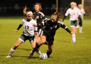 Warsaw defender Julia Frattezza looks to corral a loose ball from Northridge's Brey Baltazar.