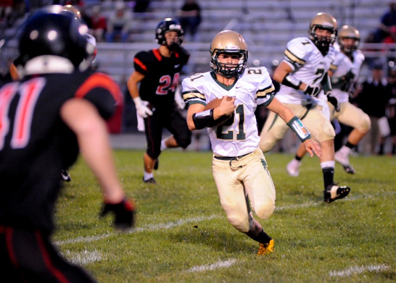Brandin McCulloch rambles for a gain for Wawasee earlier in the season. The Warriors play at winless Goshen in the regular-season finale Friday night (File photo by Mike Deak)
