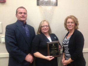 Pat Coy of the United Way accepted the agency award during yesterday's REAL service's luncheon. (Photo provided)