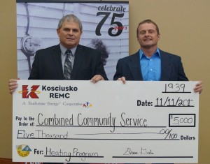 Bruce Goslee of Kosciusko REMC, left, presented a $5,000 donation to Combined Community Services for its winter heating assistance program. CCS Executive Director Steve Possell accepted the donation. (Photo provided)