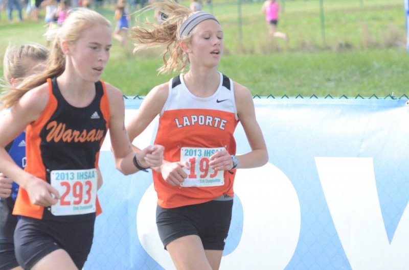 Warsaw freshman Allison Miller runs beside Kailee Schoof of LaPorte. Miller was the top finisher for the Tigers at the State Finals (Photos by Scott Davidson)