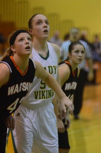 Nikki Grose of Warsaw boxes out Anne Secrest Friday night. Freshman Secrest scored a game-high 19 points to lead her Valley team to victory.