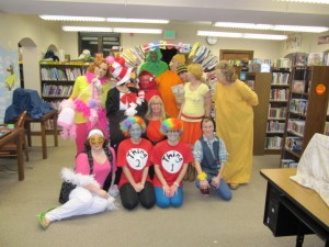 The cast for a Suessical Evening pose in front of a book arch that was made by Jay Vore. The entire lower level of the Syracuse Public Library became a Dr. Suess inspired wonderland on Halloween night. The characters are a sampling of the many creations that sprang from the mind of Theodor Geisel. The library appreciates the volunteers that helped with costumes, decorating, props and acting.  (Photo provided)