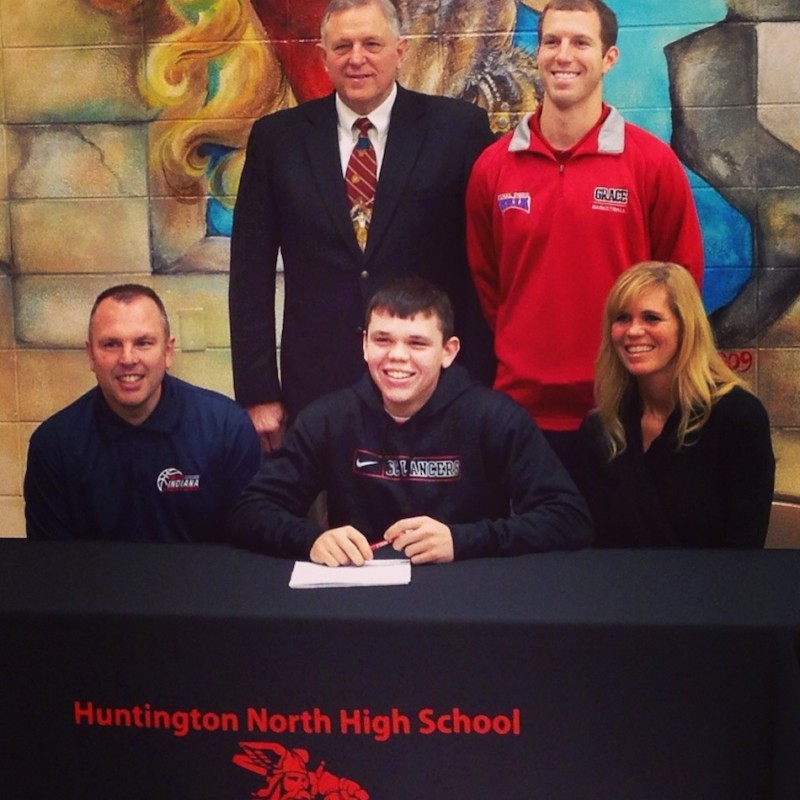 Keaton Irwin, a senior at Huntington North High School, signs to play basketball at Grace College next season. Irwin is seated in the middle of the front row flanked by his parents Rob Irwin and Krista Nicholson. In back are Grace College head coach Jim Kessler and Grace assistant coach Scott Moore (Photo provided)
