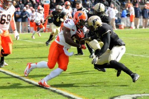 Illinois running back Josh Ferguson goes helmet to helmet with Purdue safety Taylor Richards.