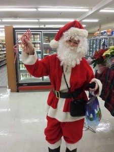 Wonda Rogers continued her Christmas tradition by dressing as Santa Claus and traveling all over Warsaw passing out candy canes. (Photo by 