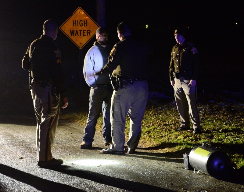 Officers of the Kosciusko County Sheriff's Department administer sobriety tests to Justin Brumfield after he drove his truck off of a county road Tuesday night near Leesburg. (Photos by Stacey Page)