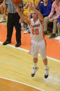 Senior Nate Pearl lets fly with a 3-point attempt for the Tigers.