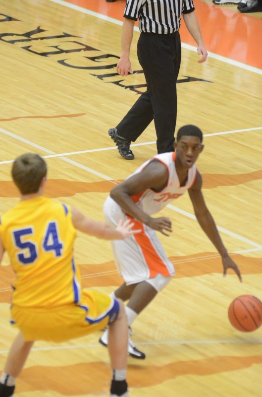 Sophomore guard Paul Marandet looks for room for Warsaw as Homestead's Dana Batt defends.