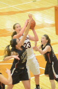 Pam Miller drives the lane for Warsaw Monday morning during a 57-44 win over Lowell in the TCU Lady Tiger Tourney.