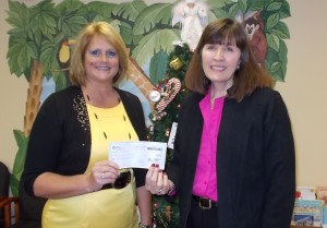 Angie Robbins (left), PNC branch manager, is shown presenting the grant check of $1,000 to Head Start Coordinator Lynne Dittman.