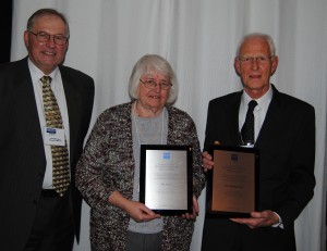 Dan Brown, left, of Phend and Brown, Milford, presented an award to Publisher Ron Baumgartner, middle, and Editor-in-Chief Jeri Seely of The Papers Inc., Milford, on Dec. 11 at the Kosciusko Innovation and Entrepreneur Hall of Fame ceremony and dinner in Warsaw. The event was hosted by Kosciusko Economic Development Corporation. (Photo by Phoebe Muthart) 