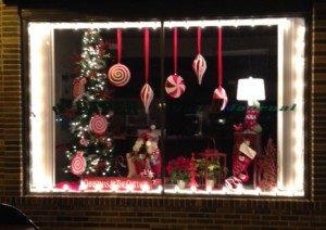 Suzanne Briggs, Wawachic, decorated the front window at the office of ‘the PAPERS’ and The Mail-Journal on Main Street for the Christmas season. The theme was “Christmas at the Cottage.” Her creativity won first place in the business category. (Photo by Susan Littlefield)