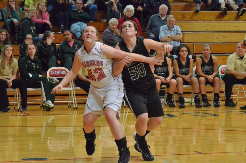Taylor Fisher of West Noble and Wawasee's Katlyn Kennedy battle under the basket following a free throw. (Photos by Nick Goralczyk)