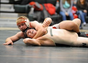Goshen's Evan Smith controls the match against Wawasee's James Hobbick in the 182-pound match. (Photos by Mike Deak)