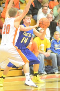 Triton's Jordan Anderson is well defended by Nate Pearl of Warsaw Friday night.