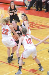 Warsaw's Pam Miller finds herself surrounded by Goshen defenders.