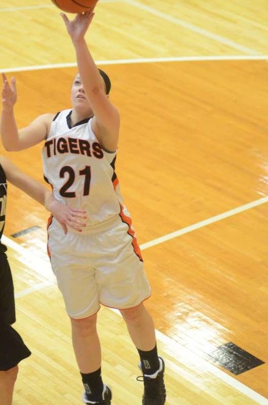 Jodie Carlson goes in for a left-handed layup for the Tigers.