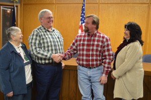 Dennis Darr, second from left, president of the Turkey Creek Township Advisory Board, welcomes newly elected board member John Heckaman. Heckaman was elected at a township precinct caucus Tuesday evening. On the far left is Barb Griffith, township trustee while on the far right is board member Kim Cates. (Photo by Deb Patterson)