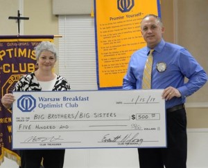 The Warsaw Breakfast Optimist Club recently donated $500 to Big Brothers Big Sisters to support mentoring in Kosciusko County.  From left is Trina Hoy accepting for the Big Brothers Big Sisters in Kosciusko County and Andy Swihart presenting the check on behalf of the Optimist Club. (Photo provided)