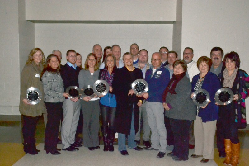 Thirteen awards were presented to businesses, individuals and organizations during Tuesday night’s chamber awards dinner. Pictured are winners and representatives of winning businesses. In front from left are: Tricia Small, Teghtmeyer Ace Hardware; Linda Slabaugh and Doug Slabaugh, Bud’s Body Shop; Brenda Peterson, Junior Achievement; Ashley Davis, Sleepy Owl; Aaron Smith, Steve Fields and Carol Roop, Oakwood Resort; Pam Schumm, Wawasee Community School Corporation; and Kelly Wedehase, Bliss Boutique. In back from left are: Bob and Rena Carlson, Maxwelton Golf Club; Chip Erwin, Rachel Larson and Jeff Larson, Sleepy Owl; Erick Leffler, Dynamic Spine and Rehabilitation Center; Mark Bulmahn, Oakwood Resort; Pat Moore, Wawasee Kiwanis; Chad Jonsson, Syracuse Parks Department; Chris Cotton; and Kip Schumm, The Papers Inc.