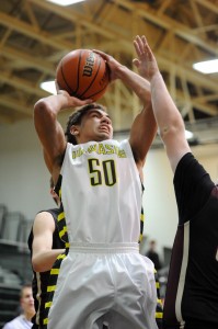 Wawasee's Stori Bright fights inside for a shot attempt against Columbia City.