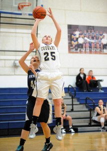 Rachel Sand of Lakeland Christian Academy rises for a basket against South Bend Trinity at the LCA Cougar Classic Friday evening. (Photos by Mike Deak)